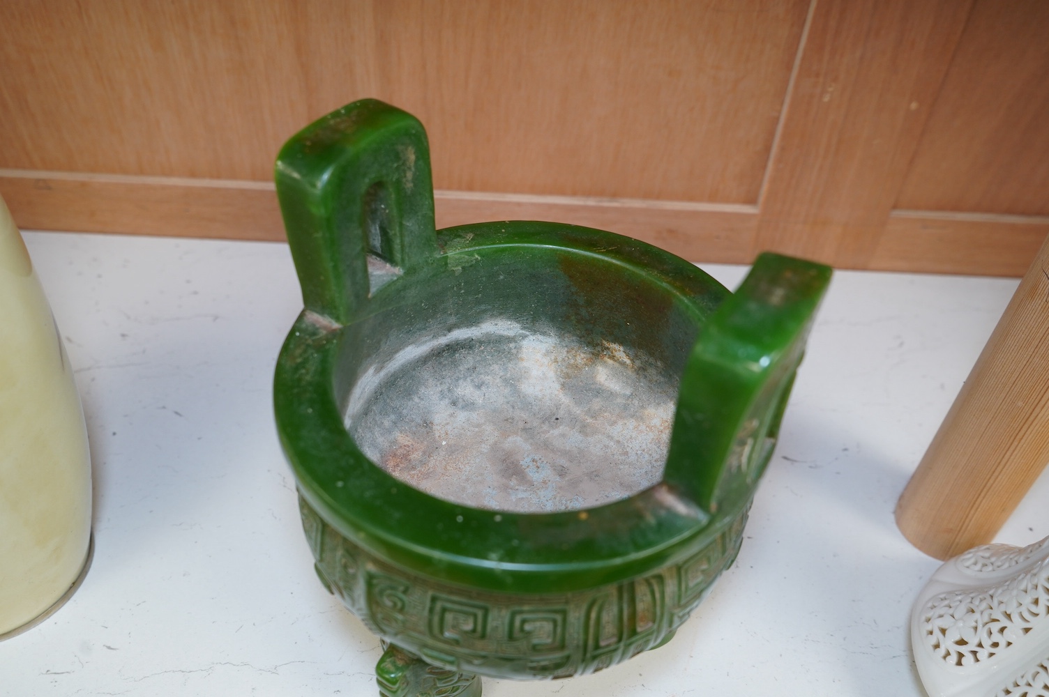 A Chinese green glass tripod censer, 20cm high. Condition - fair